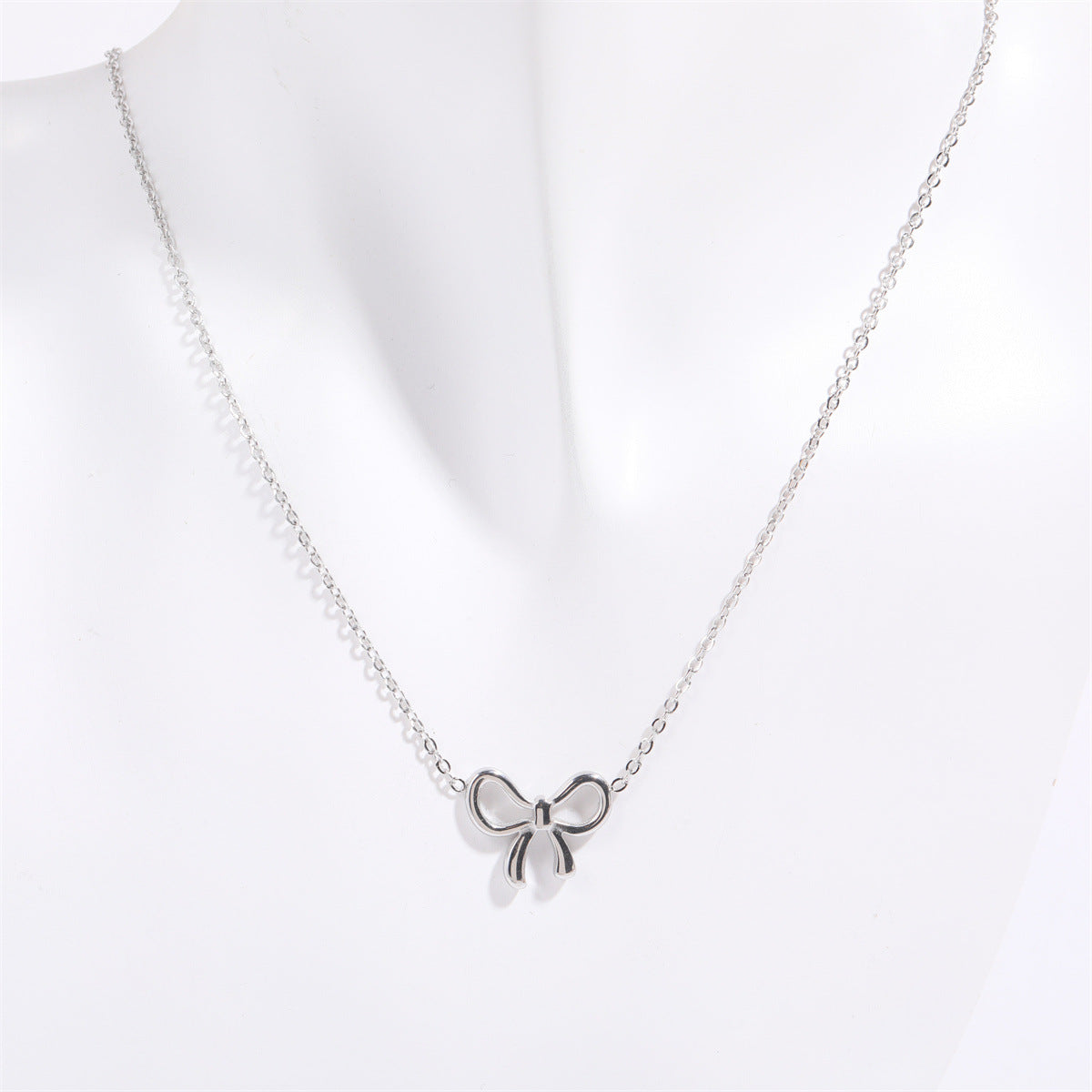 Titanium Steel Bow Pendant Necklace - The Ruffled Bull Boutique